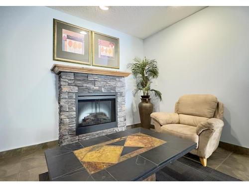 308 10403 98 Avenue, Edmonton, AB - Indoor Photo Showing Living Room With Fireplace