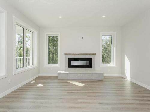 54325 Rge Rd 31, Rural Lac Ste. Anne County, AB - Indoor Photo Showing Living Room With Fireplace