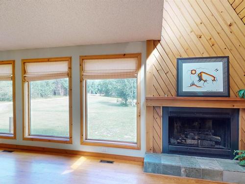 51 53026 Hghway 31, Rural Parkland County, AB - Indoor Photo Showing Living Room With Fireplace