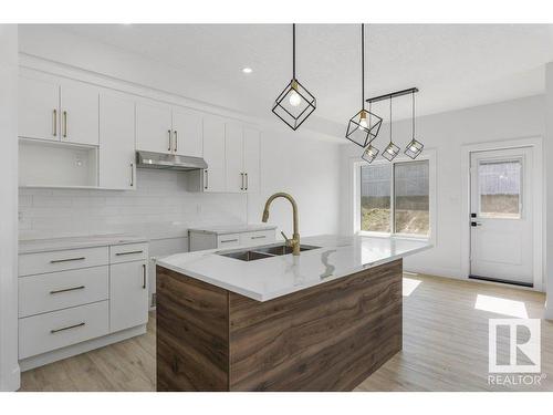 81 Silverstone Drive, Stony Plain, AB - Indoor Photo Showing Kitchen With Double Sink With Upgraded Kitchen