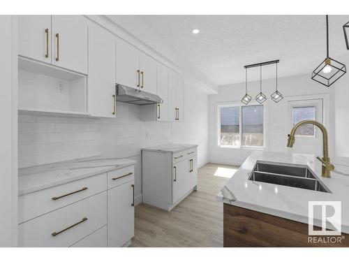 81 Silverstone Drive, Stony Plain, AB - Indoor Photo Showing Kitchen With Double Sink