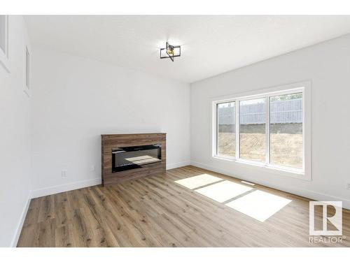 81 Silverstone Drive, Stony Plain, AB - Indoor Photo Showing Living Room With Fireplace