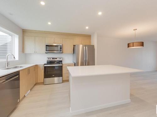 121 Stiles Link, Leduc, AB - Indoor Photo Showing Kitchen With Stainless Steel Kitchen With Double Sink With Upgraded Kitchen