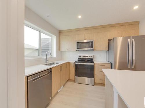 121 Stiles Link, Leduc, AB - Indoor Photo Showing Kitchen With Stainless Steel Kitchen With Double Sink