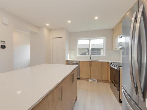 121 Stiles Link, Leduc, AB - Indoor Photo Showing Kitchen With Stainless Steel Kitchen