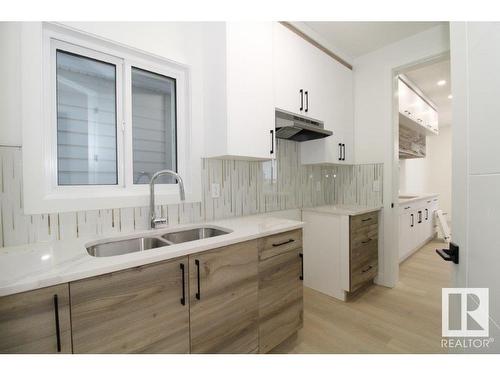 17128 2 Street, Edmonton, AB - Indoor Photo Showing Kitchen With Double Sink