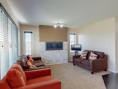 3204 17B Avenue Nw, Edmonton, AB - Indoor Photo Showing Living Room With Fireplace