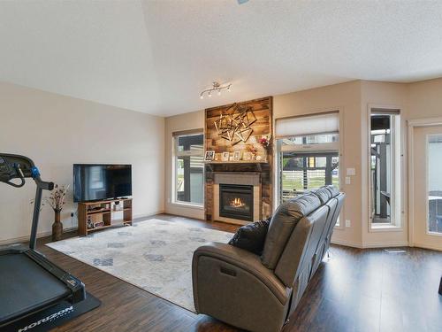 21108 92B Avenue Nw, Edmonton, AB - Indoor Photo Showing Living Room With Fireplace