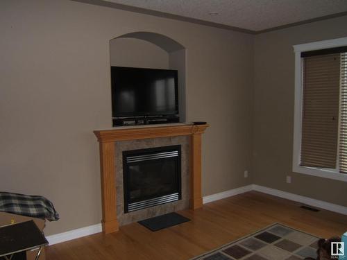 26 Whitetail Crescent, Mundare, AB - Indoor Photo Showing Living Room With Fireplace