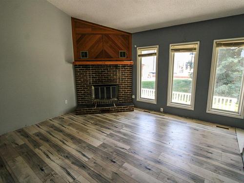 St. Paul Town, AB - Indoor Photo Showing Other Room With Fireplace