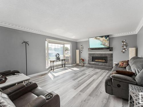 4405 44 Avenue, Bonnyville Town, AB - Indoor Photo Showing Living Room With Fireplace