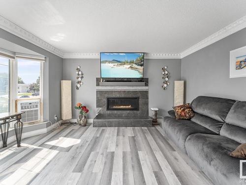 4405 44 Avenue, Bonnyville Town, AB - Indoor Photo Showing Living Room With Fireplace