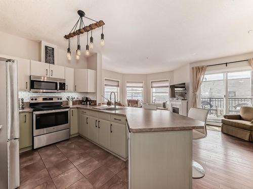 205 9927 79 Avenue, Edmonton, AB - Indoor Photo Showing Kitchen With Stainless Steel Kitchen