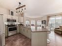 205 9927 79 Avenue, Edmonton, AB  - Indoor Photo Showing Kitchen With Stainless Steel Kitchen 