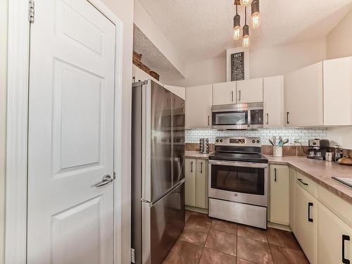 205 9927 79 Avenue, Edmonton, AB - Indoor Photo Showing Kitchen With Stainless Steel Kitchen