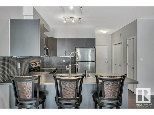 106 10611 117 Street, Edmonton, AB - Indoor Photo Showing Kitchen With Stainless Steel Kitchen