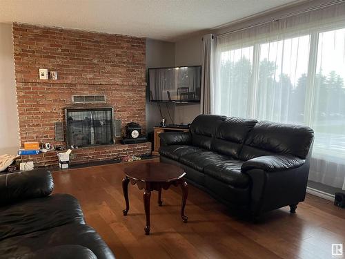 5310 52 Avenue, Elk Point, AB - Indoor Photo Showing Living Room With Fireplace