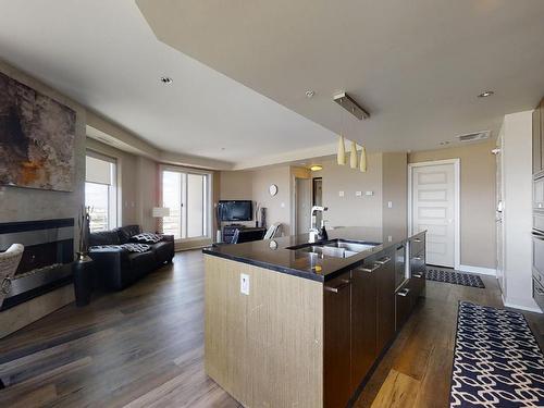 1804 10388 105 Street, Edmonton, AB - Indoor Photo Showing Kitchen With Fireplace With Double Sink