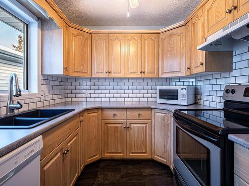 A 4301 48 Street, Leduc, AB - Indoor Photo Showing Kitchen With Double Sink