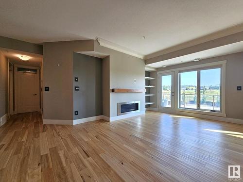 306 5201 Brougham Drive, Drayton Valley, AB - Indoor Photo Showing Living Room With Fireplace