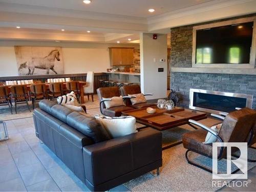 306 5201 Brougham Drive, Drayton Valley, AB - Indoor Photo Showing Living Room With Fireplace