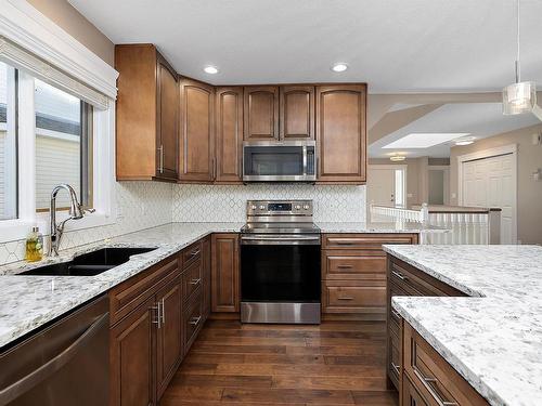 108 Ravine Villa(S), Leduc, AB - Indoor Photo Showing Kitchen With Double Sink With Upgraded Kitchen