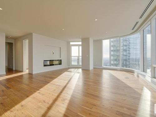 4704 10360 102 Street, Edmonton, AB - Indoor Photo Showing Living Room With Fireplace