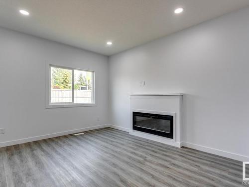 31 Caledon Crescent, Spruce Grove, AB - Indoor Photo Showing Living Room With Fireplace