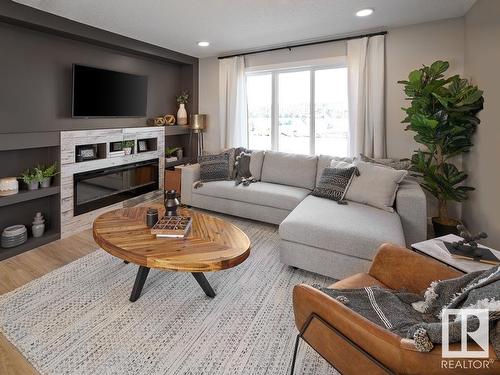 25 29 Airport Road, Edmonton, AB - Indoor Photo Showing Living Room With Fireplace