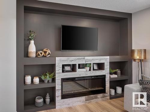 25 29 Airport Road, Edmonton, AB - Indoor Photo Showing Living Room With Fireplace