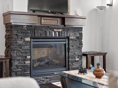 3813 Macneil Heath, Edmonton, AB - Indoor Photo Showing Living Room With Fireplace