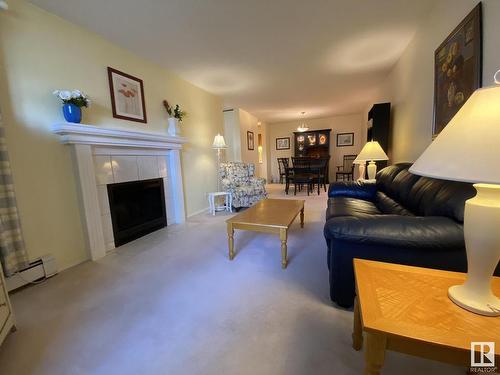 113 14811 51 Avenue, Edmonton, AB - Indoor Photo Showing Living Room With Fireplace