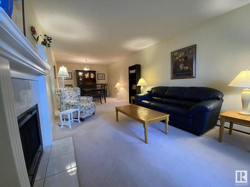 113 14811 51 Avenue, Edmonton, AB - Indoor Photo Showing Living Room With Fireplace