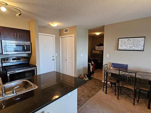 415 3207 James Mowatt Trail, Edmonton, AB - Indoor Photo Showing Kitchen With Double Sink