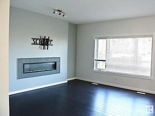 7315 Creighton Close, Edmonton, AB - Indoor Photo Showing Living Room With Fireplace