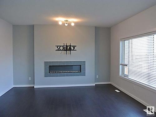 7315 Creighton Close, Edmonton, AB - Indoor Photo Showing Living Room With Fireplace