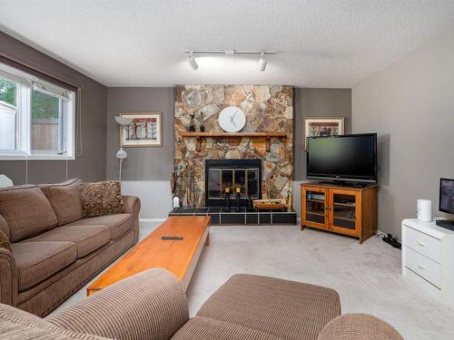 26 Lennox Drive, St. Albert, AB - Indoor Photo Showing Living Room With Fireplace