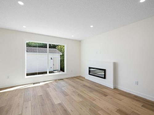 11740 91 Street, Edmonton, AB - Indoor Photo Showing Living Room With Fireplace