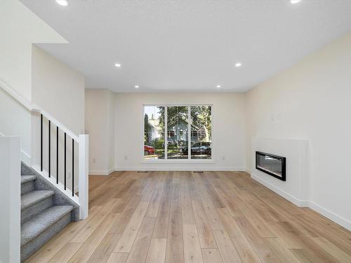 11740 91 Street, Edmonton, AB - Indoor Photo Showing Living Room With Fireplace