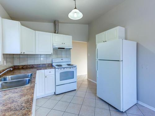 9516 127 Avenue, Edmonton, AB - Indoor Photo Showing Kitchen With Double Sink