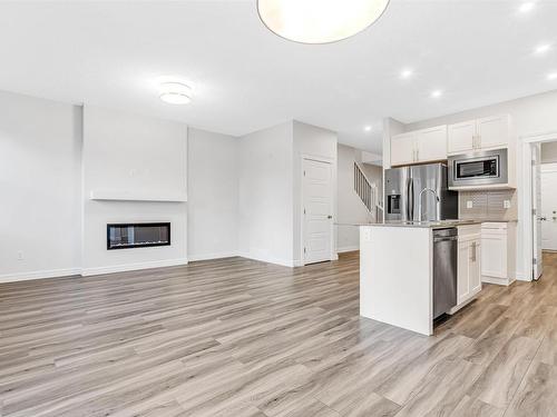 1608 16 Street, Edmonton, AB - Indoor Photo Showing Kitchen With Fireplace