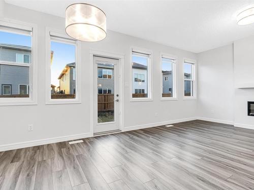 1608 16 Street, Edmonton, AB - Indoor Photo Showing Other Room With Fireplace