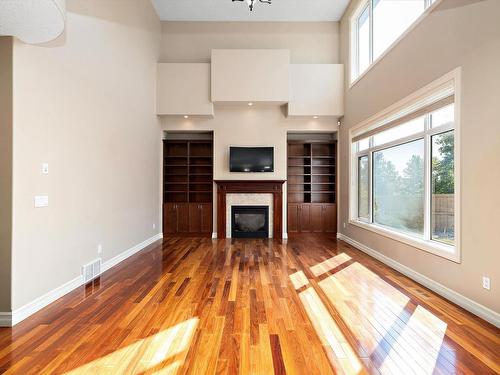 817 Hollands Landing Landing, Edmonton, AB - Indoor Photo Showing Other Room With Fireplace