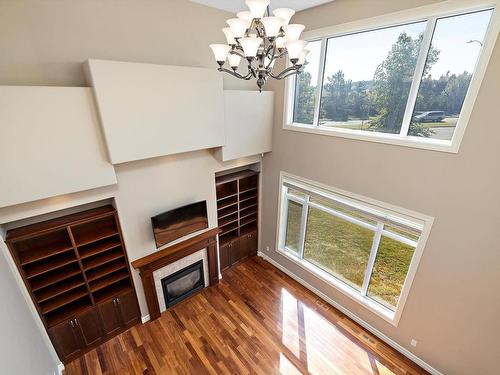 817 Hollands Landing Landing, Edmonton, AB - Indoor Photo Showing Other Room With Fireplace