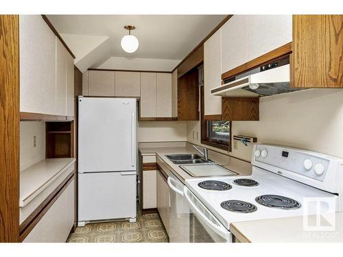 9803 92 Avenue, Edmonton, AB - Indoor Photo Showing Kitchen With Double Sink