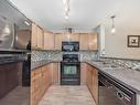 124 646 Mcallister Loop, Edmonton, AB  - Indoor Photo Showing Kitchen With Double Sink 