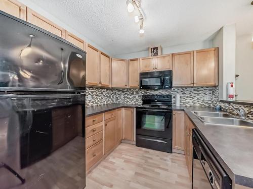 124 646 Mcallister Loop, Edmonton, AB - Indoor Photo Showing Kitchen With Double Sink