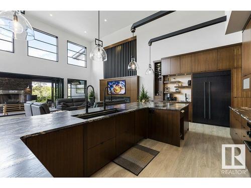 6 Lake Ridge Estates, Rural Parkland County, AB - Indoor Photo Showing Kitchen With Fireplace