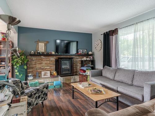 2A St Vital Avenue, St. Albert, AB - Indoor Photo Showing Living Room With Fireplace