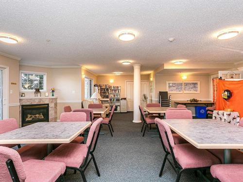 101 17150 94A Avenue, Edmonton, AB - Indoor Photo Showing Dining Room With Fireplace